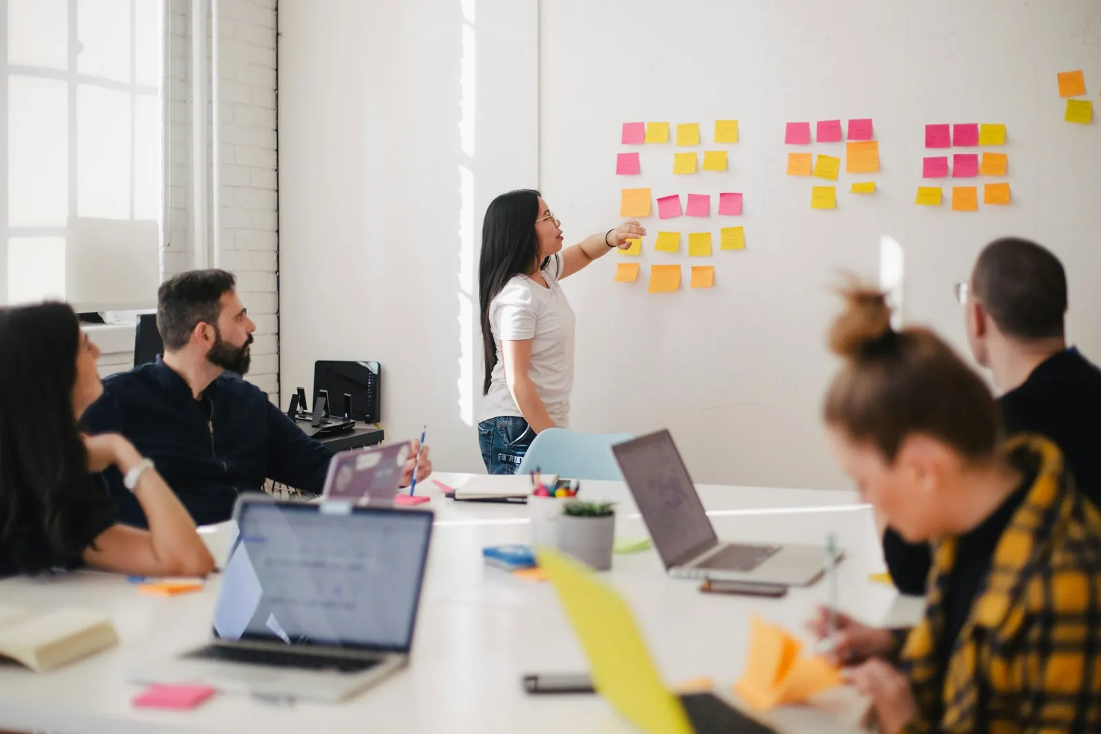 A team planning a campaign at a whiteboard